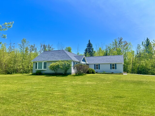 1745 Mullett Lake Woods Rd, Cheboygan, MI 49721 - single story home featuring a front lawn