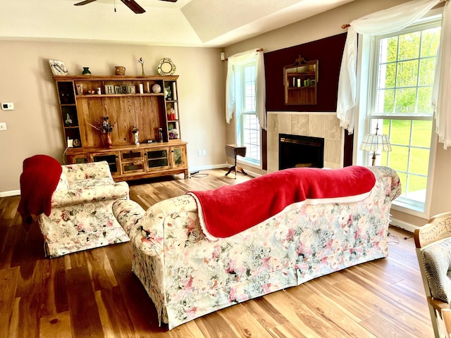 1745 Mullett Lake Woods Rd, Cheboygan, MI 49721 - living area with a ceiling fan, healthy amount of natural light, and baseboards