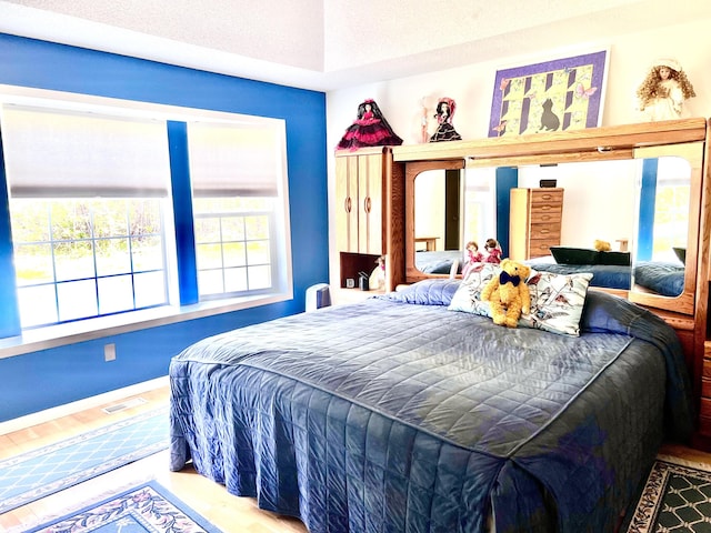 1745 Mullett Lake Woods Rd, Cheboygan, MI 49721 - bedroom featuring wood finished floors