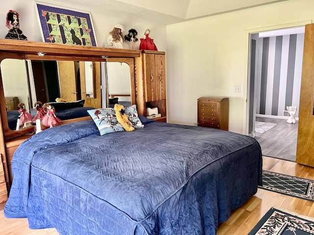 1745 Mullett Lake Woods Rd, Cheboygan, MI 49721 - bedroom featuring wood finished floors