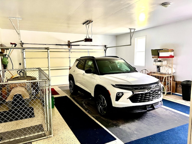 1745 Mullett Lake Woods Rd, Cheboygan, MI 49721 - garage featuring a garage door opener