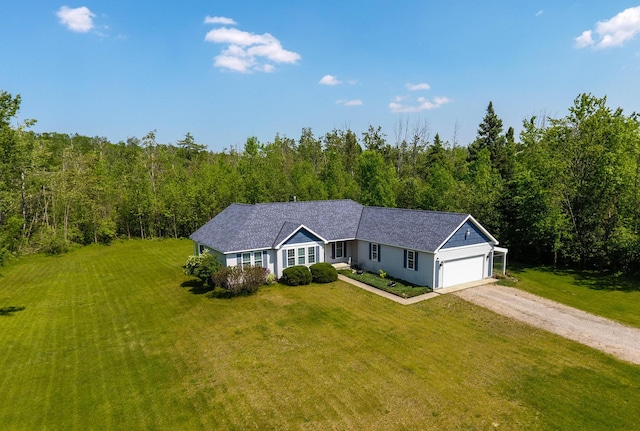 1745 Mullett Lake Woods Rd, Cheboygan, MI 49721 - single story home with dirt driveway, a front yard, a view of trees, and a garage