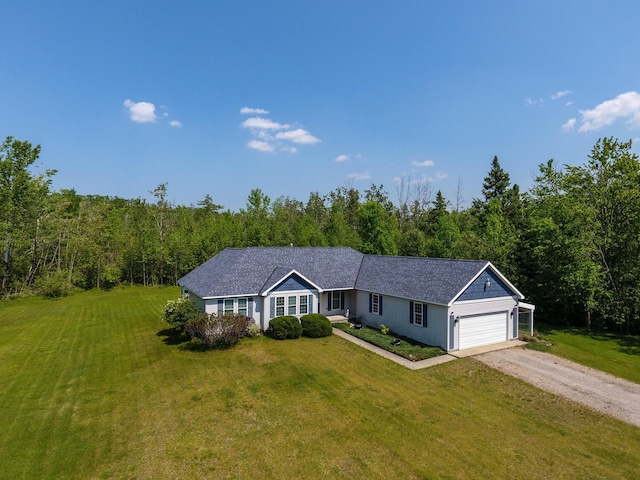 1745 Mullett Lake Woods Rd, Cheboygan, MI 49721 - ranch-style house featuring dirt driveway, a front lawn, a wooded view, and a garage