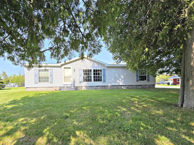 106 Hazel St, Saint Ignace, MI 49781 - manufactured / mobile home featuring a front yard, crawl space, and entry steps