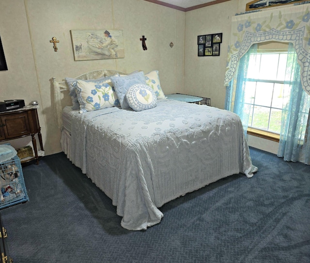 106 Hazel St, Saint Ignace, MI 49781 - bedroom with dark carpet and crown molding
