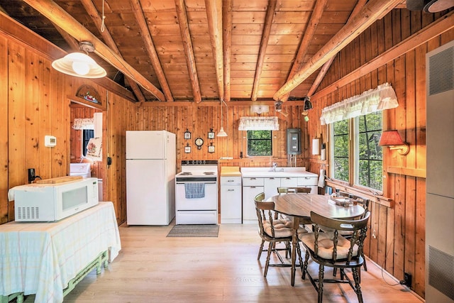 2080 Tomahawk Trl, Gaylord, MI 49735 - kitchen with white appliances, wooden walls, plenty of natural light, light wood-type flooring, and wooden ceiling