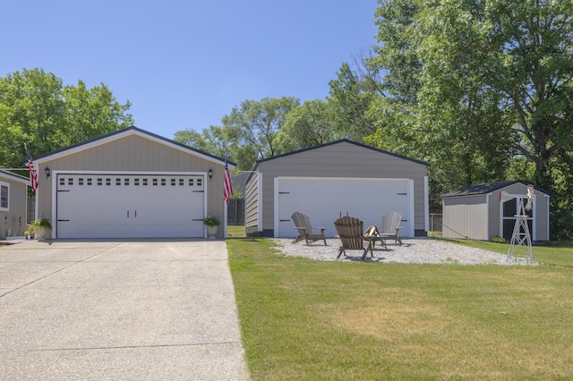 217 Cherry St, Houghton Lake, MI 48629 - view of front of property featuring a garage, a front yard, and a shed