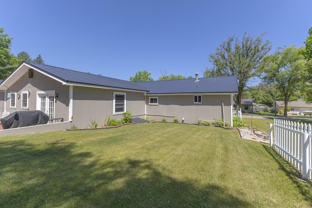 217 Cherry St, Houghton Lake, MI 48629 - back of property with a metal roof