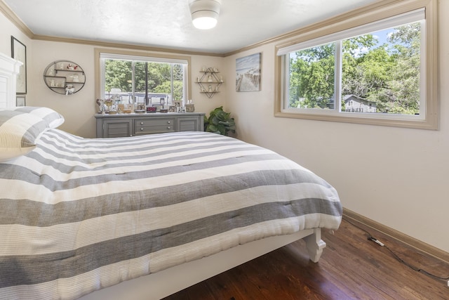 217 Cherry St, Houghton Lake, MI 48629 - bedroom featuring wood finished floors and ornamental molding