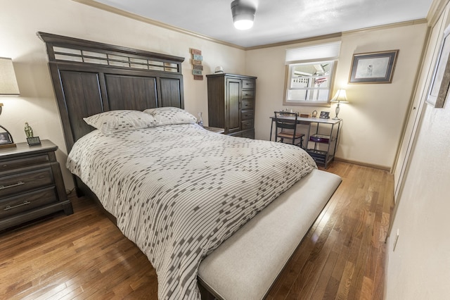 217 Cherry St, Houghton Lake, MI 48629 - bedroom featuring wood-type flooring and ornamental molding