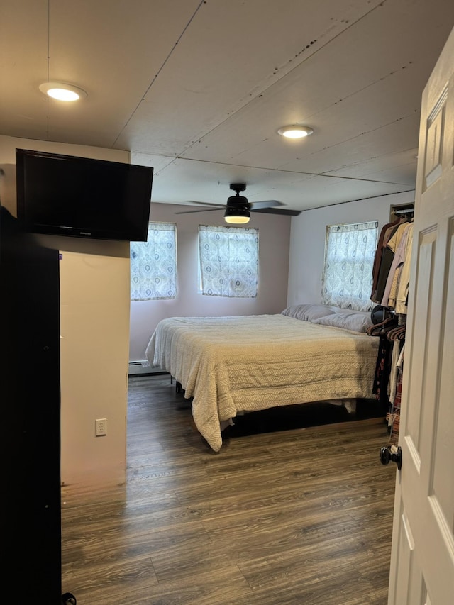 3134 Kneeland St, Lewiston, MI 49756 - bedroom featuring multiple windows and wood finished floors