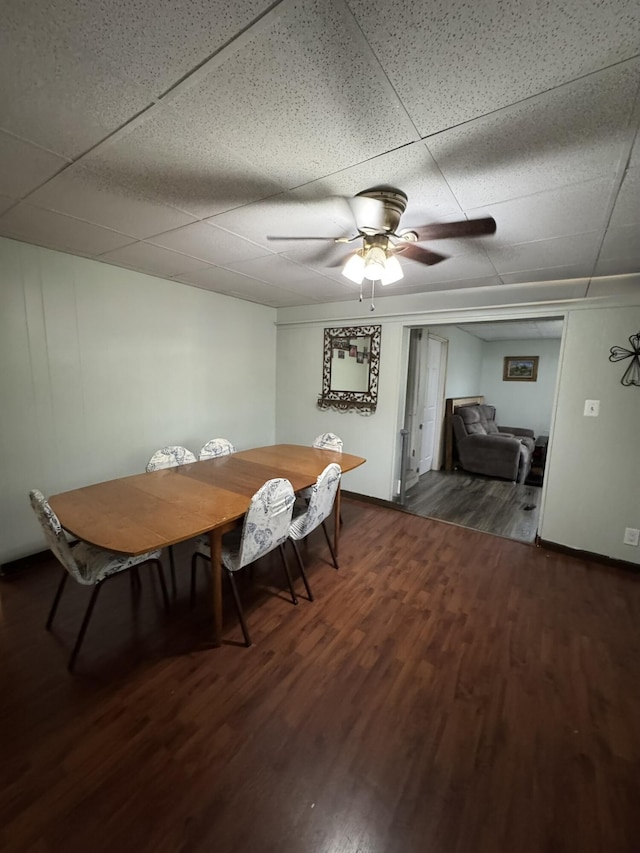 3134 Kneeland St, Lewiston, MI 49756 - dining space with wood finished floors, a ceiling fan, and a drop ceiling