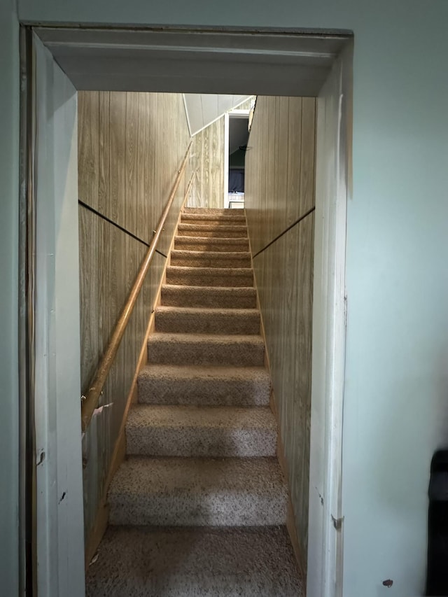 3134 Kneeland St, Lewiston, MI 49756 - staircase with wood walls