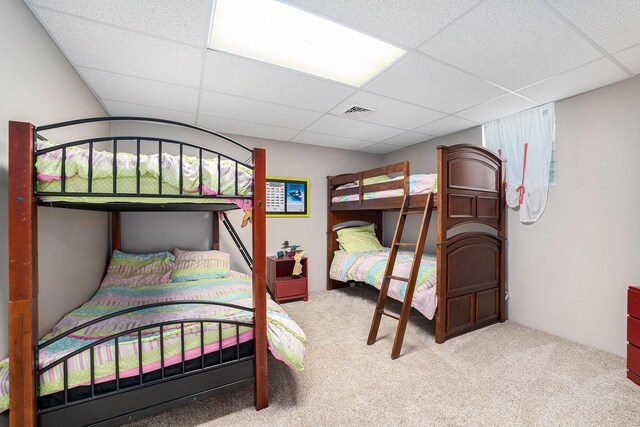 10702 Southwood Dr, Mancelona, MI 49659 - bedroom featuring carpet and a paneled ceiling