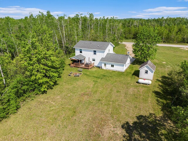 10702 Southwood Dr, Mancelona, MI 49659 - aerial view of property and surrounding area with a heavily wooded area