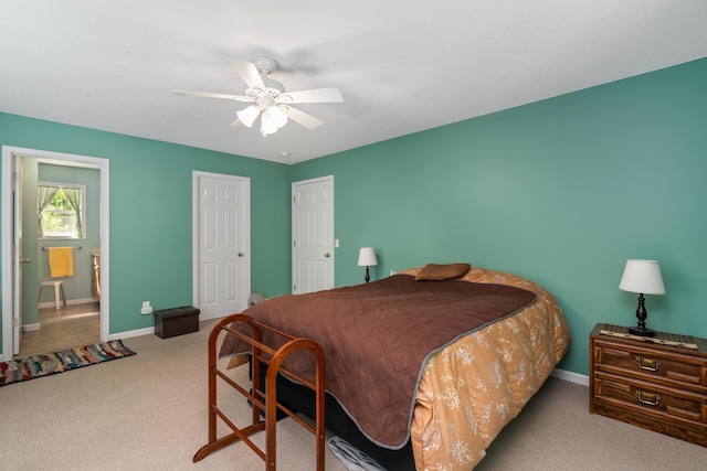 11193 Hassler Woods Trl, Alanson, MI 49706 - carpeted bedroom featuring baseboards and ceiling fan