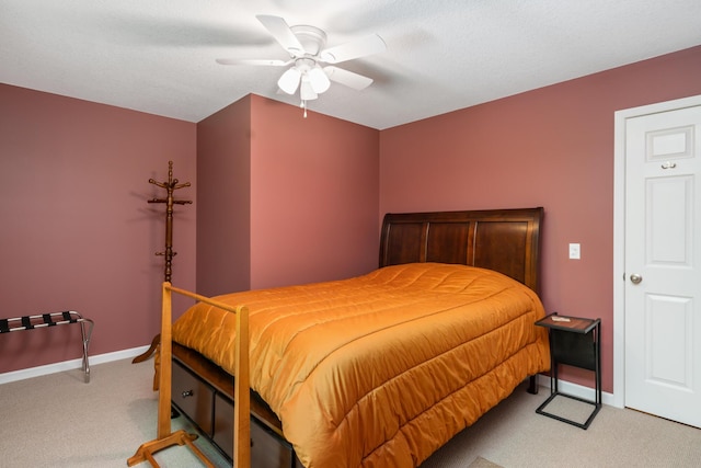 11193 Hassler Woods Trl, Alanson, MI 49706 - bedroom featuring light carpet, baseboards, and a ceiling fan