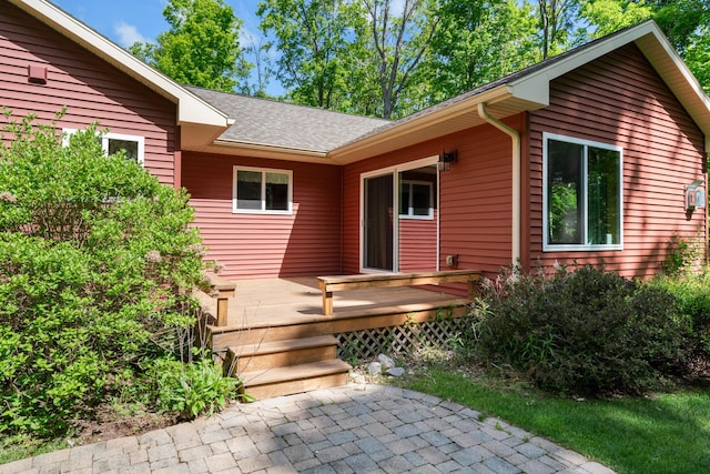 11193 Hassler Woods Trl, Alanson, MI 49706 - entrance to property with a wooden deck and a shingled roof