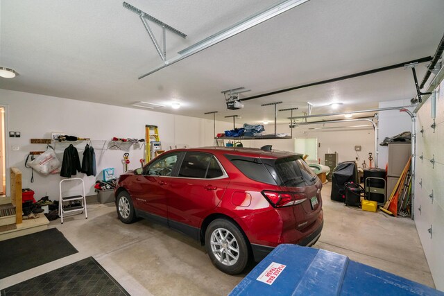 11193 Hassler Woods Trl, Alanson, MI 49706 - garage with a garage door opener
