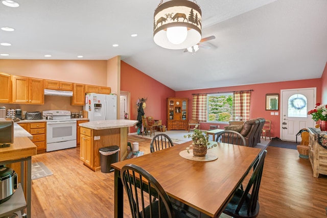 11193 Hassler Woods Trl, Alanson, MI 49706 - dining area featuring lofted ceiling, light wood-style flooring, ceiling fan, and recessed lighting