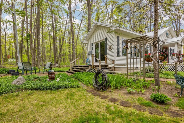 7106 Douglas Lake Rd, Johannesburg, MI 49751 - view of side of property with a wooden deck