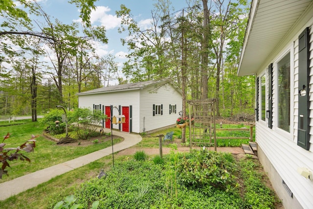 7106 Douglas Lake Rd, Johannesburg, MI 49751 - view of grassy yard with an outdoor structure