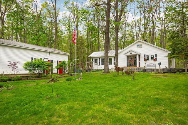 7106 Douglas Lake Rd, Johannesburg, MI 49751 - view of green lawn featuring a wooden deck