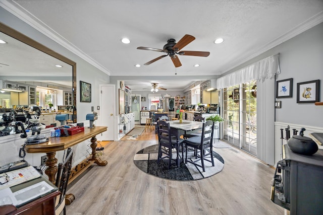 7106 Douglas Lake Rd, Johannesburg, MI 49751 - dining space with a ceiling fan, ornamental molding, recessed lighting, plenty of natural light, and light wood-style floors