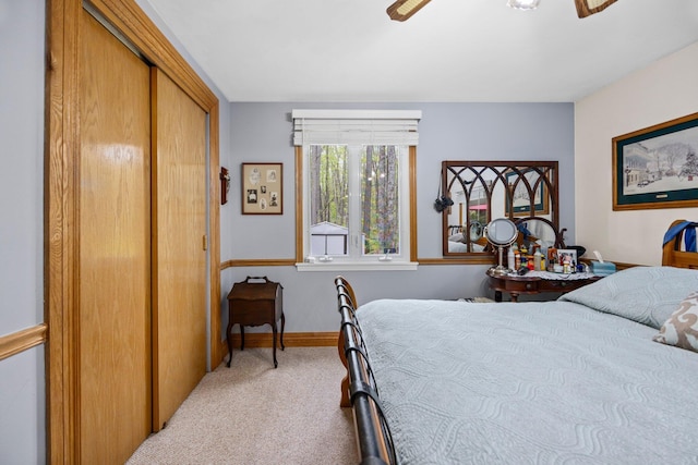 7106 Douglas Lake Rd, Johannesburg, MI 49751 - carpeted bedroom with baseboards and ceiling fan