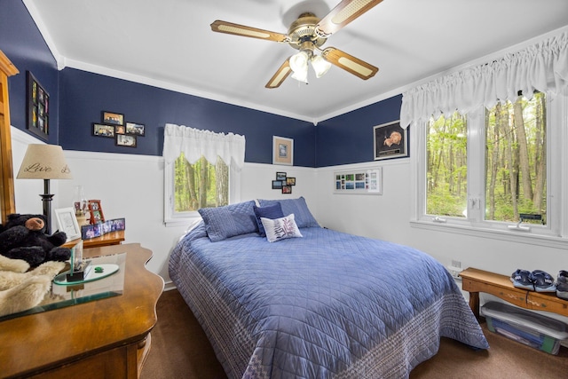 7106 Douglas Lake Rd, Johannesburg, MI 49751 - bedroom with carpet flooring, a ceiling fan, wainscoting, and crown molding