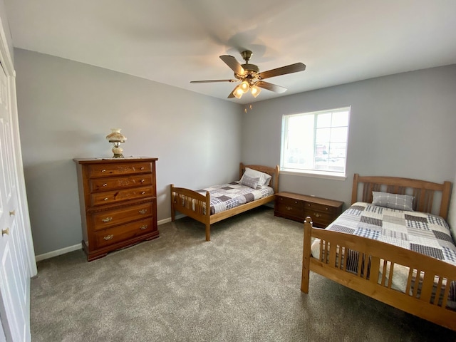 2476 W Branch Dr, West Branch, MI 48661 - carpeted bedroom with a ceiling fan and baseboards