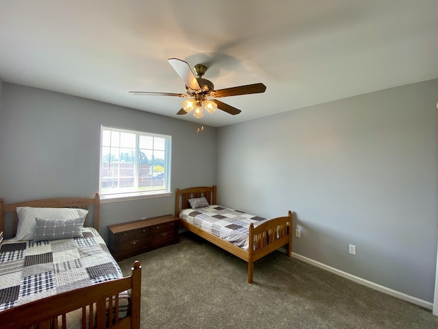 2476 W Branch Dr, West Branch, MI 48661 - bedroom featuring carpet floors, a ceiling fan, and baseboards