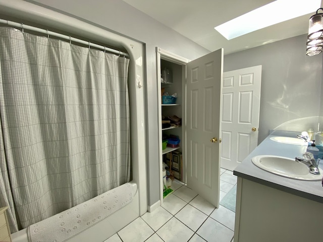 2476 W Branch Dr, West Branch, MI 48661 - full bathroom featuring a skylight, tile patterned flooring, double vanity, and a shower with curtain