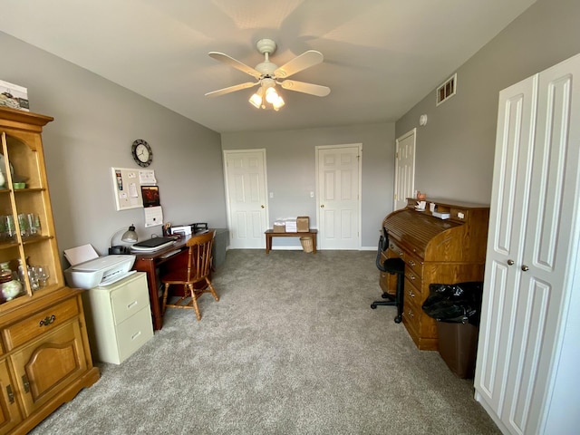 2476 W Branch Dr, West Branch, MI 48661 - home office with a ceiling fan, carpet floors, and baseboards
