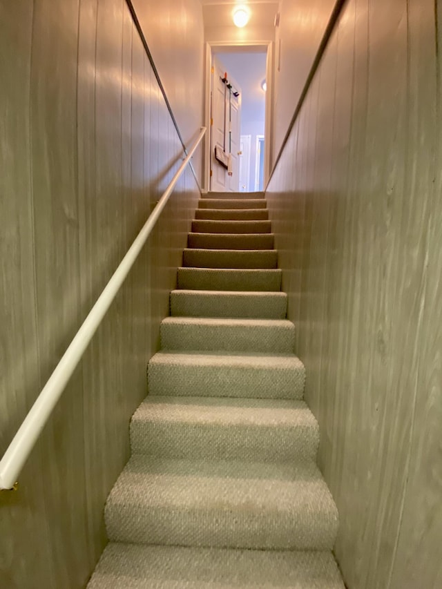 2476 W Branch Dr, West Branch, MI 48661 - stairway with wood walls