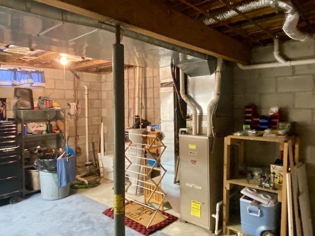 2476 W Branch Dr, West Branch, MI 48661 - unfinished below grade area with heating unit