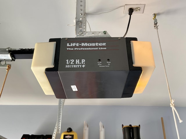 2476 W Branch Dr, West Branch, MI 48661 - detailed view of a garage door opener