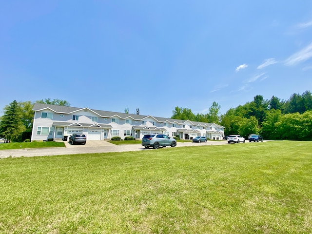 2476 W Branch Dr, West Branch, MI 48661 - view of grassy yard featuring a residential view