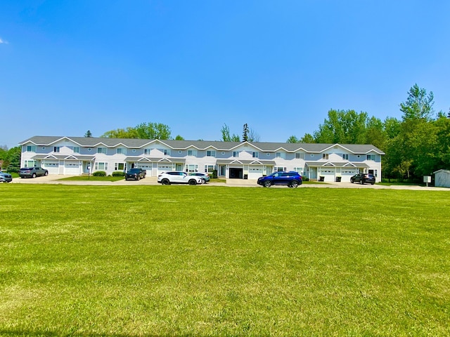 2476 W Branch Dr, West Branch, MI 48661 - multi unit property with a front lawn, uncovered parking, and a residential view