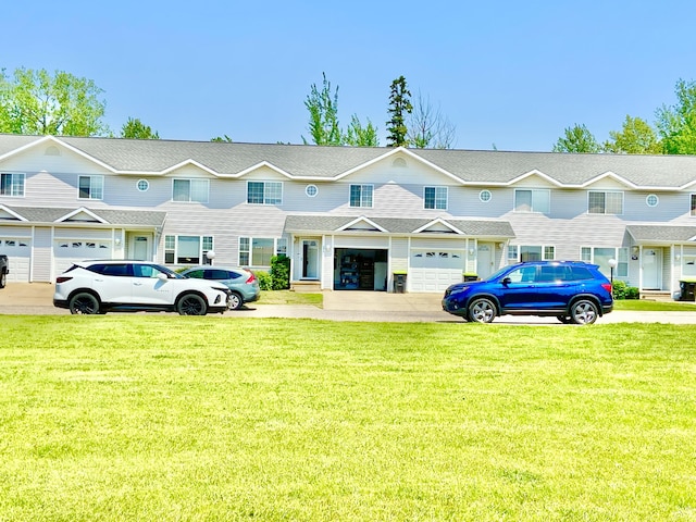 2476 W Branch Dr, West Branch, MI 48661 - townhome / multi-family property with a front lawn
