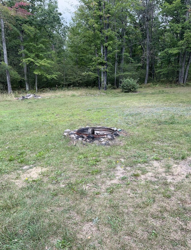 7781 N M-18, Roscommon, MI 48653 - view of yard featuring an outdoor fire pit