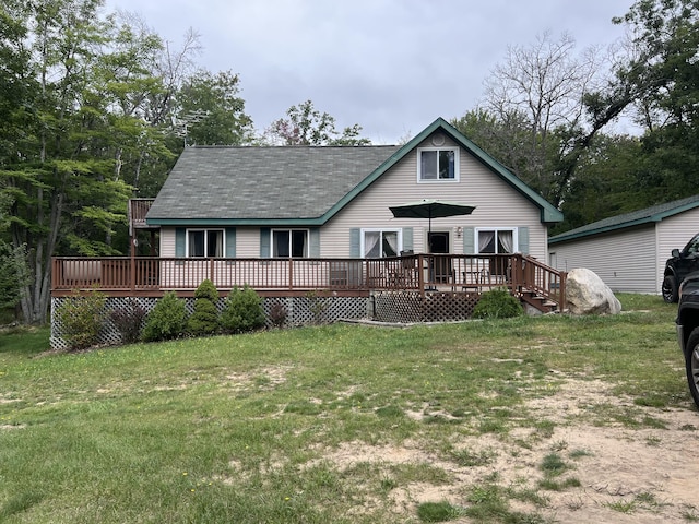 7781 N M-18, Roscommon, MI 48653 - back of house with a deck, a yard, and a shingled roof