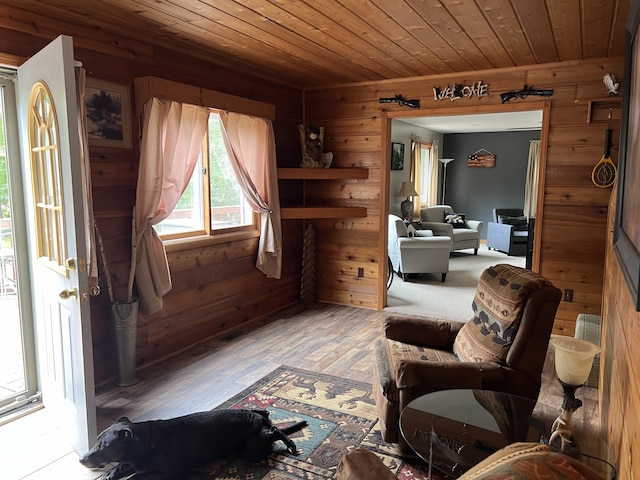 7781 N M-18, Roscommon, MI 48653 - living room with wood ceiling, wood walls, and wood finished floors