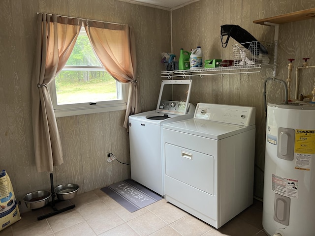 7781 N M-18, Roscommon, MI 48653 - washroom featuring electric water heater, washing machine and clothes dryer, and light tile patterned floors