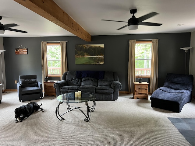 7781 N M-18, Roscommon, MI 48653 - carpeted living area with ceiling fan, healthy amount of natural light, beam ceiling, and baseboards