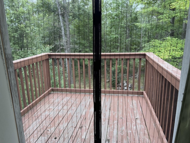 7781 N M-18, Roscommon, MI 48653 - deck with a forest view