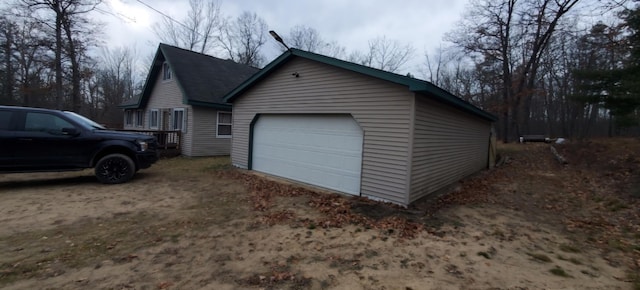 7781 N M-18, Roscommon, MI 48653 - view of home's exterior featuring a garage