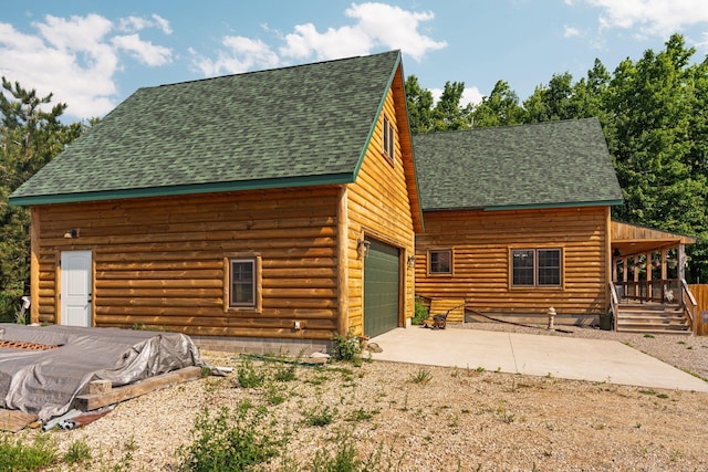 8406 S Shire Rd, Vanderbilt, MI 49795 - view of front of home featuring concrete driveway and a shingled roof