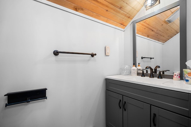 8406 S Shire Rd, Vanderbilt, MI 49795 - bathroom featuring lofted ceiling, vanity, and wood ceiling