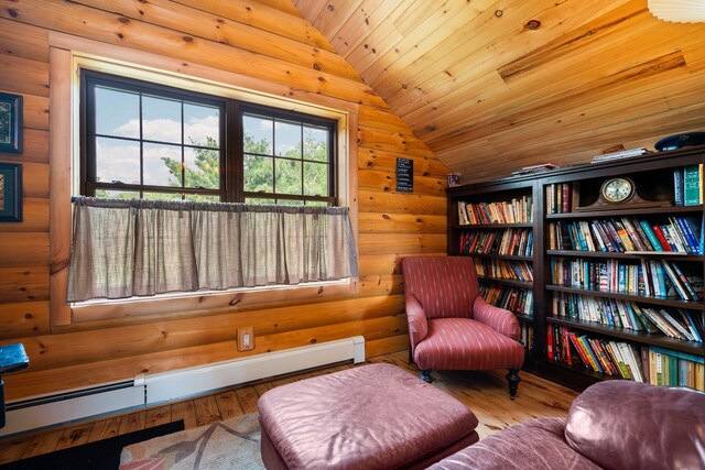 8406 S Shire Rd, Vanderbilt, MI 49795 - sitting room featuring vaulted ceiling, hardwood / wood-style flooring, baseboard heating, wood ceiling, and log walls